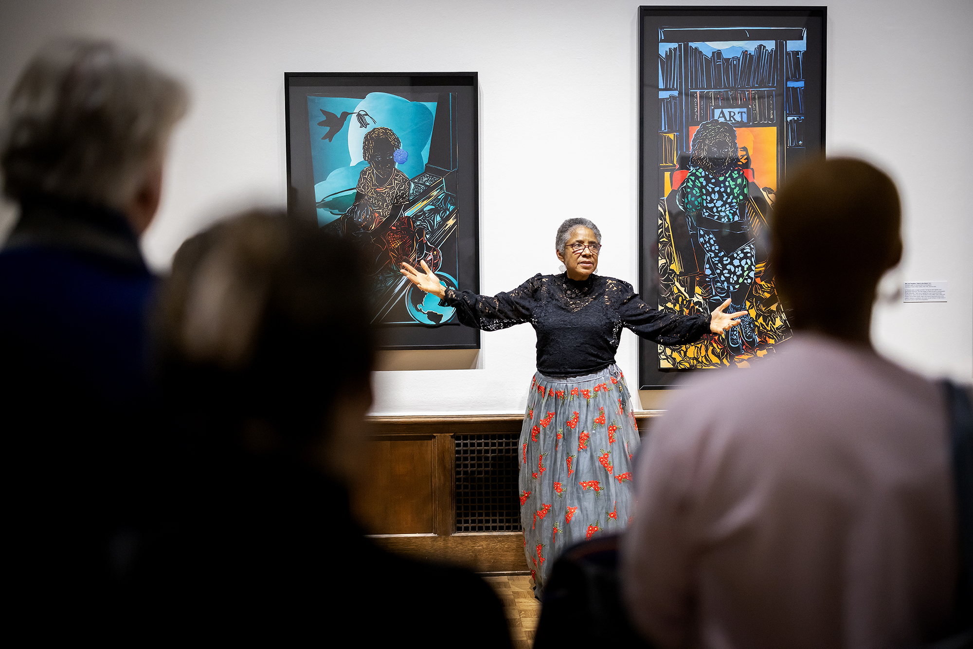 Barbara Earl Thomas in front of her artwork