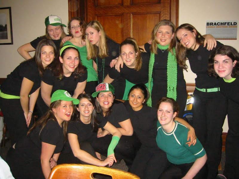 Female-performers-wearing-black-and-green-outfits
