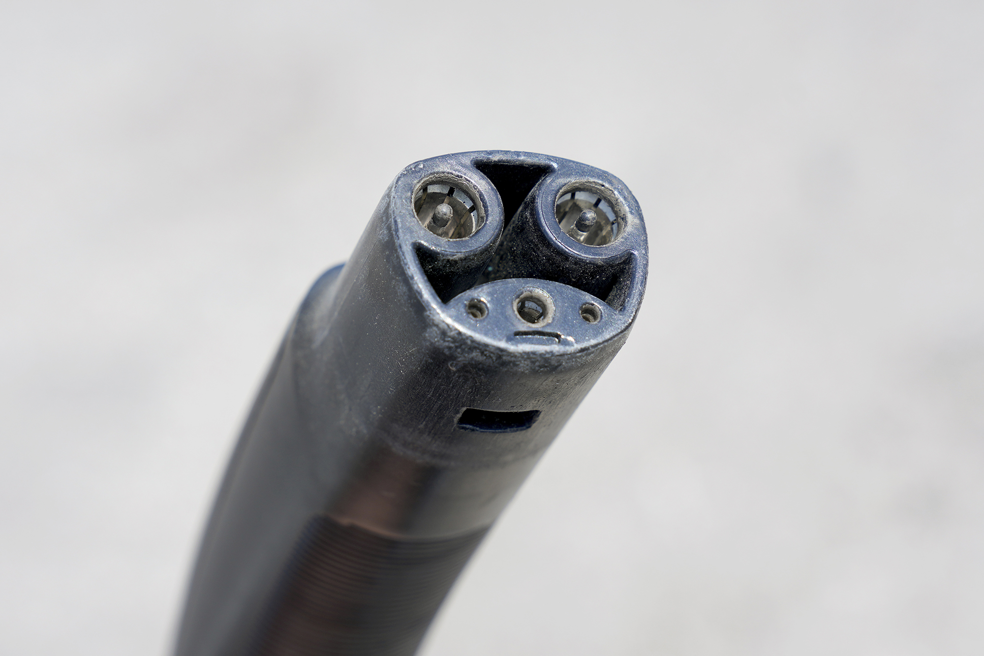 View of Tesla charger plug with pins.