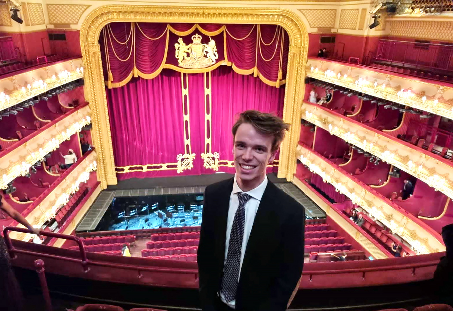 Thomas Sharrock standing in the balcony of the Royal Opera House 
