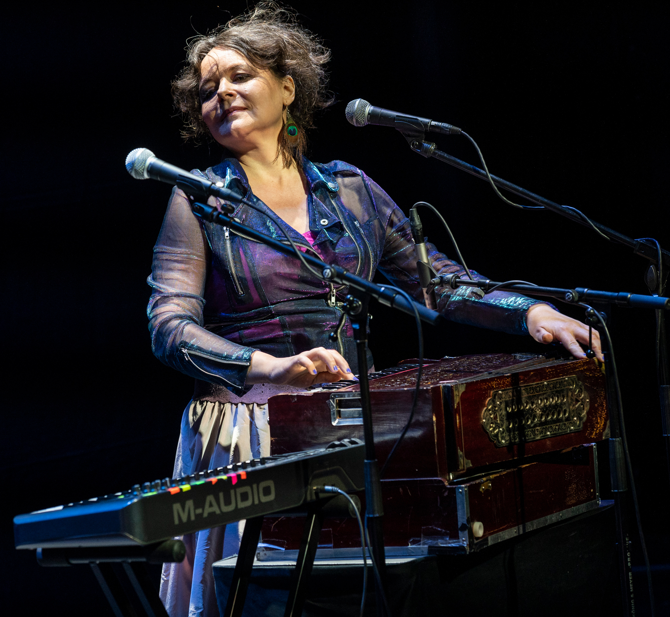 Mariana Sadovska with a keyboard and microphones. 