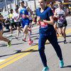 Samantha Roecker running in the Boston Marathon, with many runners around her. She wears bib number 281.