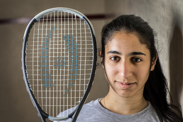 Reeham Sedky of the women's squash team poses with a squash racket.