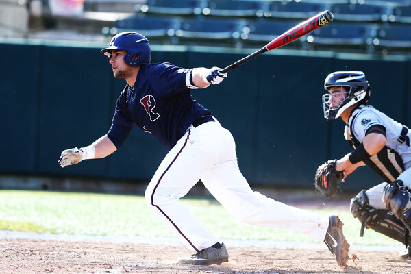 Freshman Andrew Hernandez heads to first base after making contact with the ball during a game.