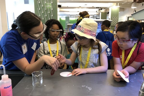 students in a lab looking at filter paper
