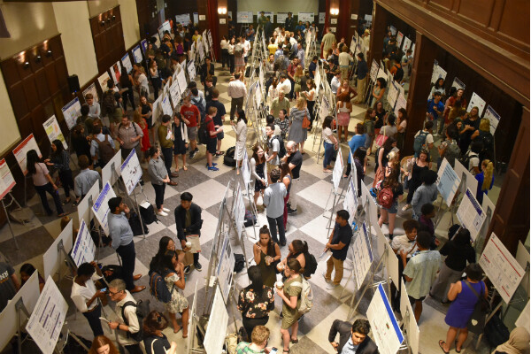 Aerial view of hallway with CURF poster displays and students