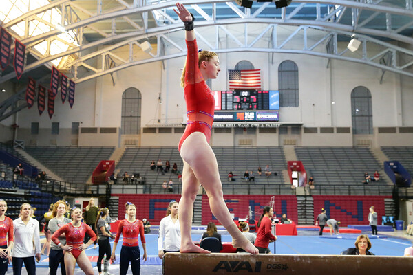 During a meet at the Palestra, freshman Rebekah Lashley performs on the beam.