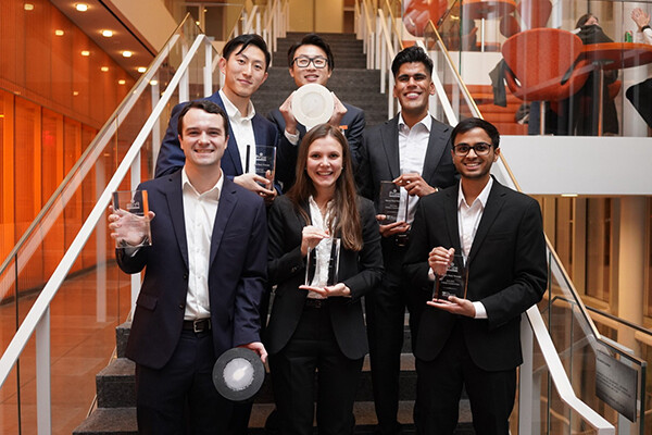 Yumin Gao, Leo Li, Minhal Dhanjy, Darsham Bhosale, Kateryna Kharenko and Ryan Goethals (clockwise from top left) pose with their prototypes and trophies. 