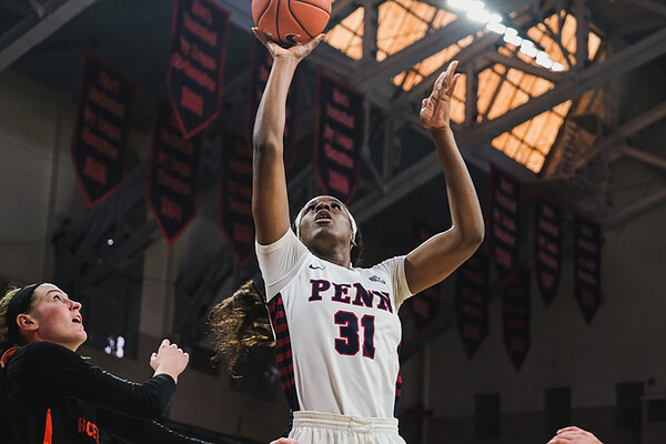 Junior center Eleah Parker shoots a shot near the basketball against Princeton at the Palestra.