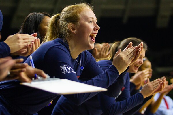 Liz Satter of the women's basketball team claps for her teammates from the bench during a game against Notre Dame.