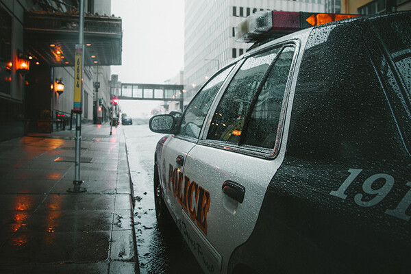 Police car on a rainy Philadelphia street.