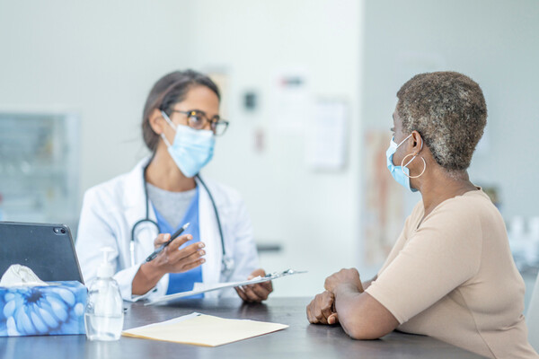 A doctor talking with a patient.